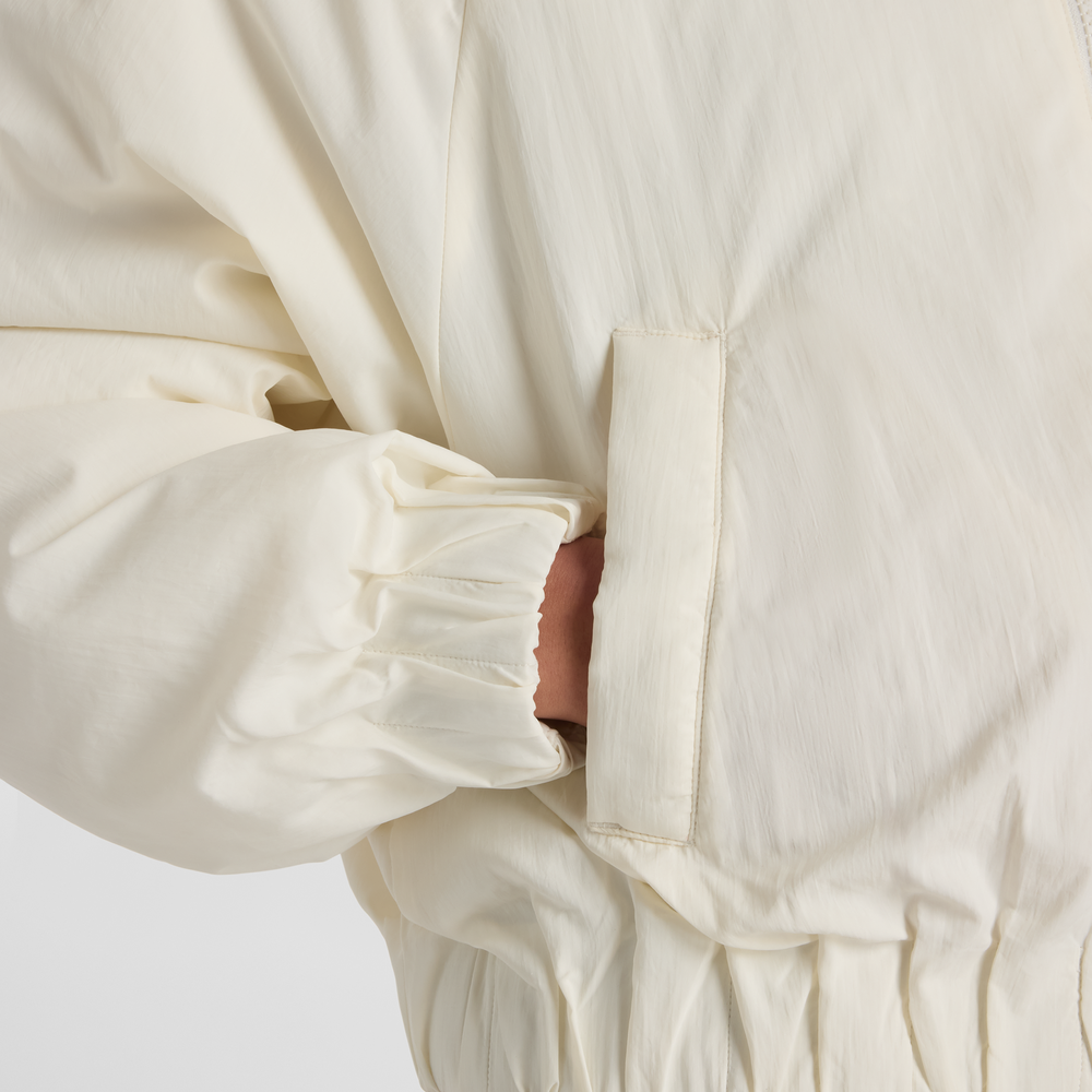 Női dzseki New Balance WJ61D8YXSST​ – bézs