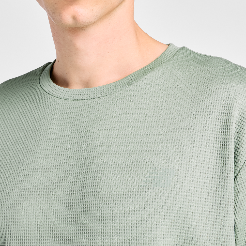 Férfi futópóló New Balance MT6100FRAAR – zöld