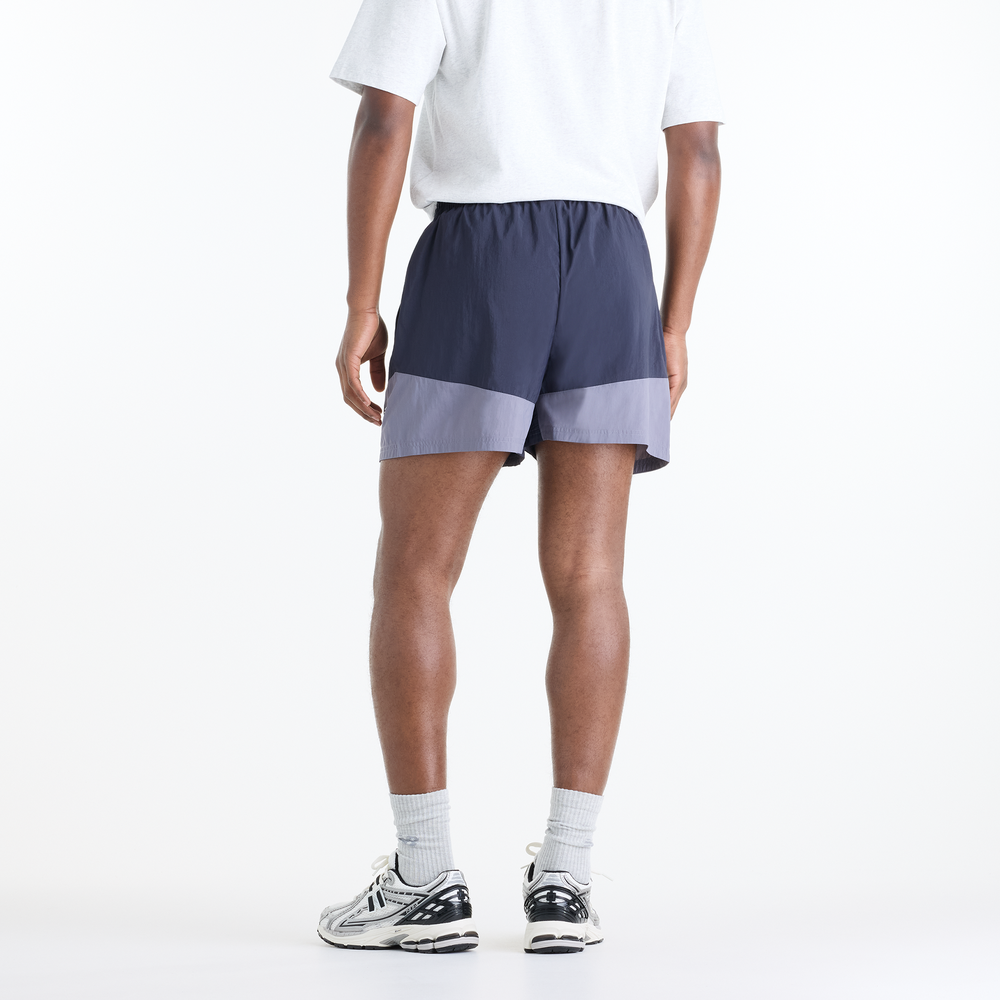 Férfi futónadrág New Balance Sport Legacy – lila