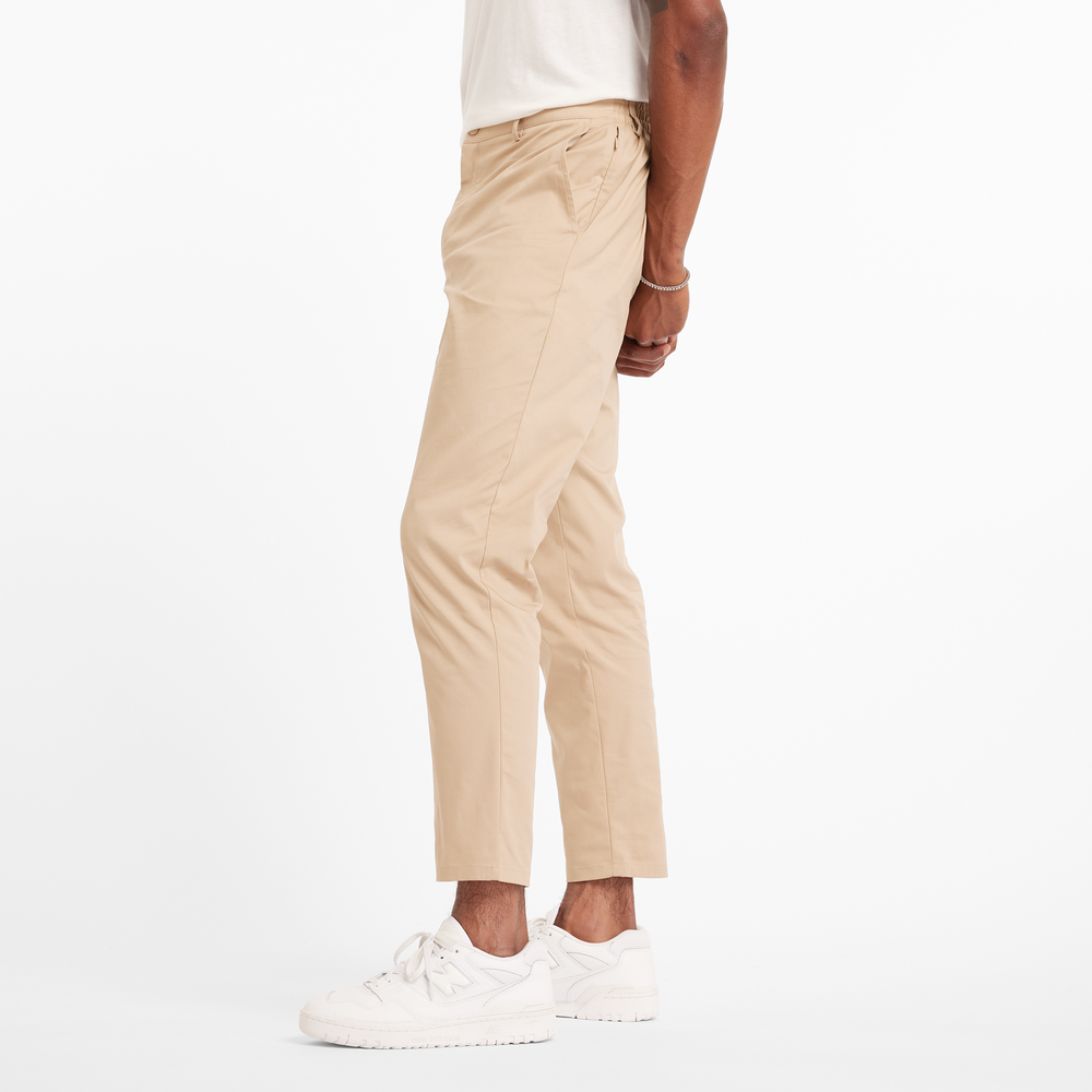 Férfi nadrág New Balance MP43554SOT – bézs