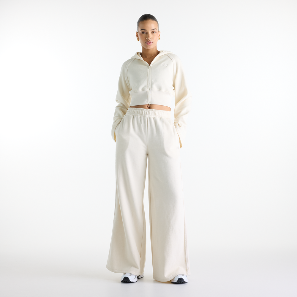 Női nadrág New Balance Brushed Coastal – bézs