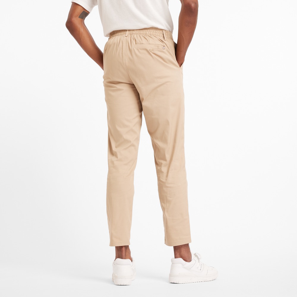 Férfi nadrág New Balance MP43554SOT – bézs
