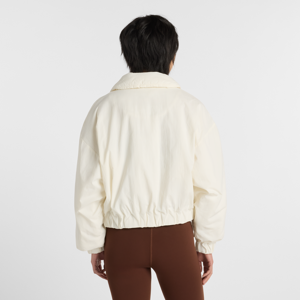 Női dzseki New Balance WJ61D8YXSST​ – bézs