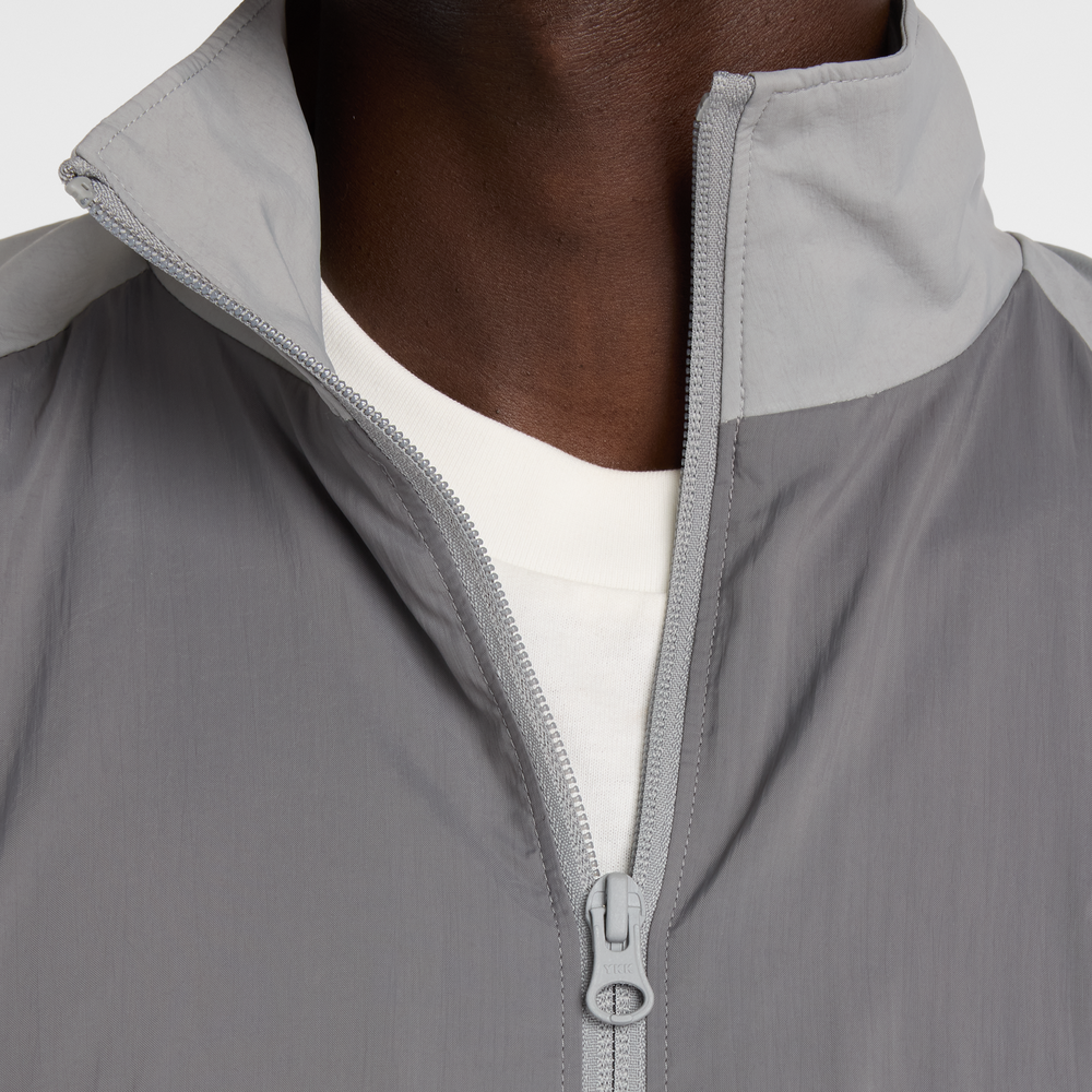 Férfi kabát New Balance MJ61J73YCAS – szürke