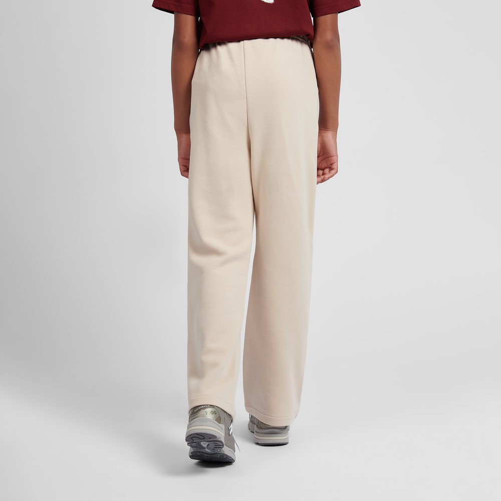 Gyerek nadrágok New Balance LAKG0216BIS – bézs