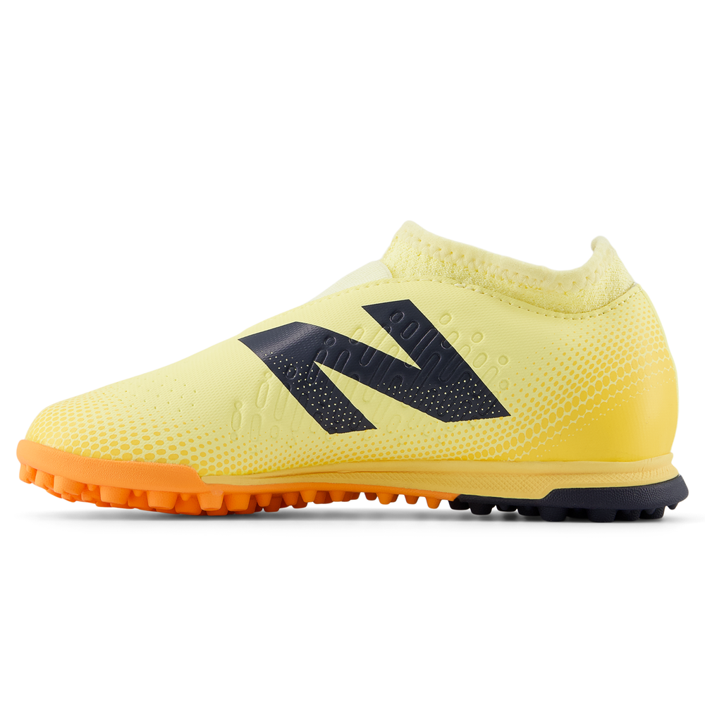 Gyermek turf cipő New Balance TEKELA V4+ MAGIQUE JNR FG SJT3TJ45 – sárga