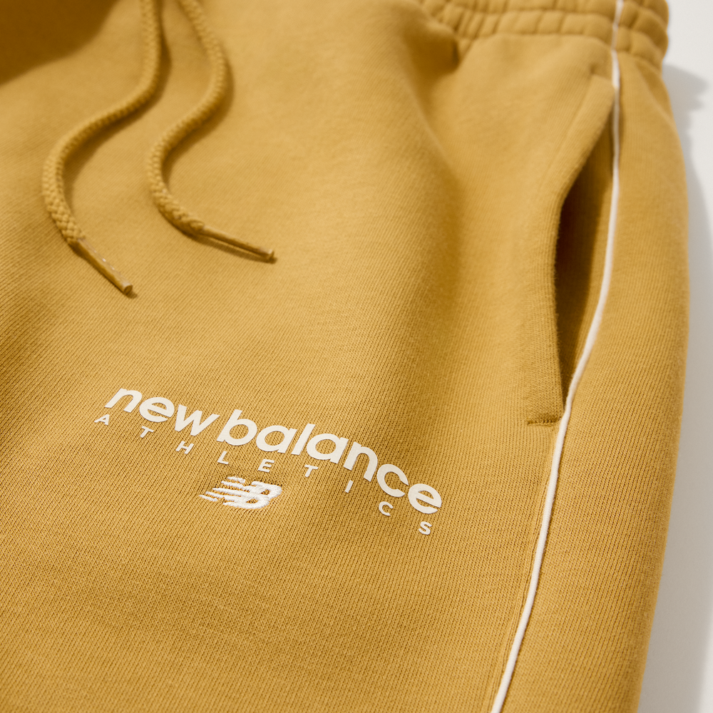 Férfi nadrág New Balance MB61M77EABG – narancssárga