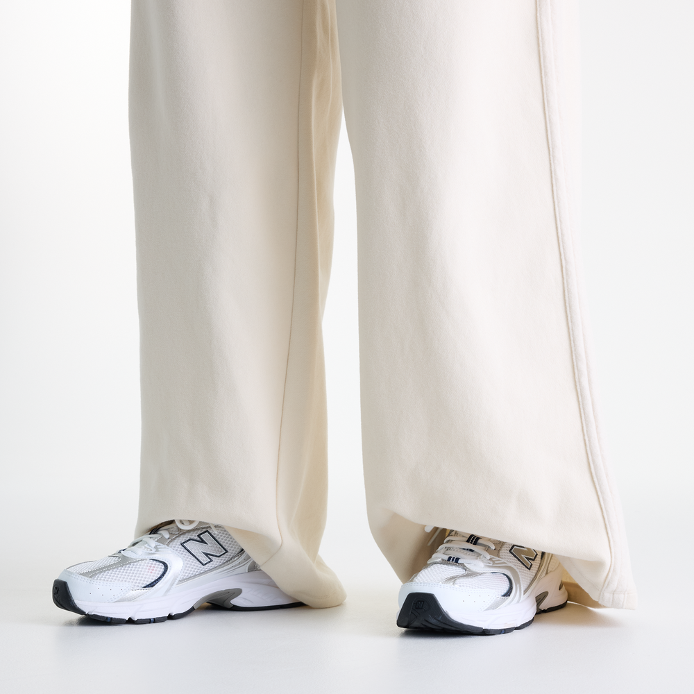 Női nadrág New Balance Brushed Coastal – bézs